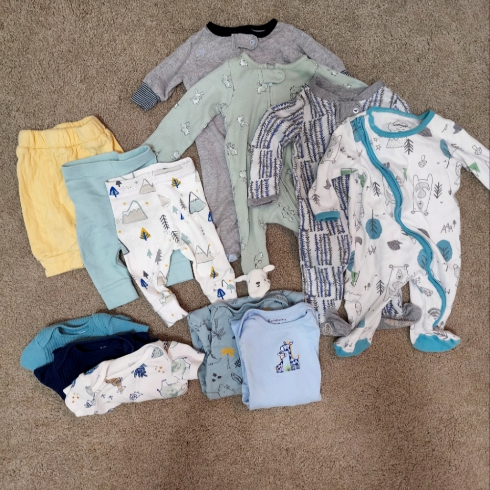 Newborn onesies, pants, sleep sacks, and footie pajamas.
